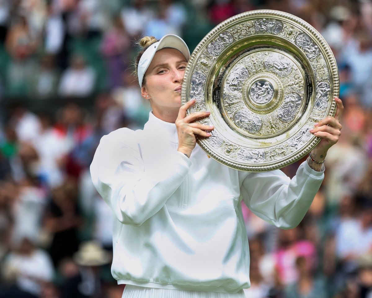 Marketa Vondrousova kisses the Wimbledon women’s singles title trophy in 2023.