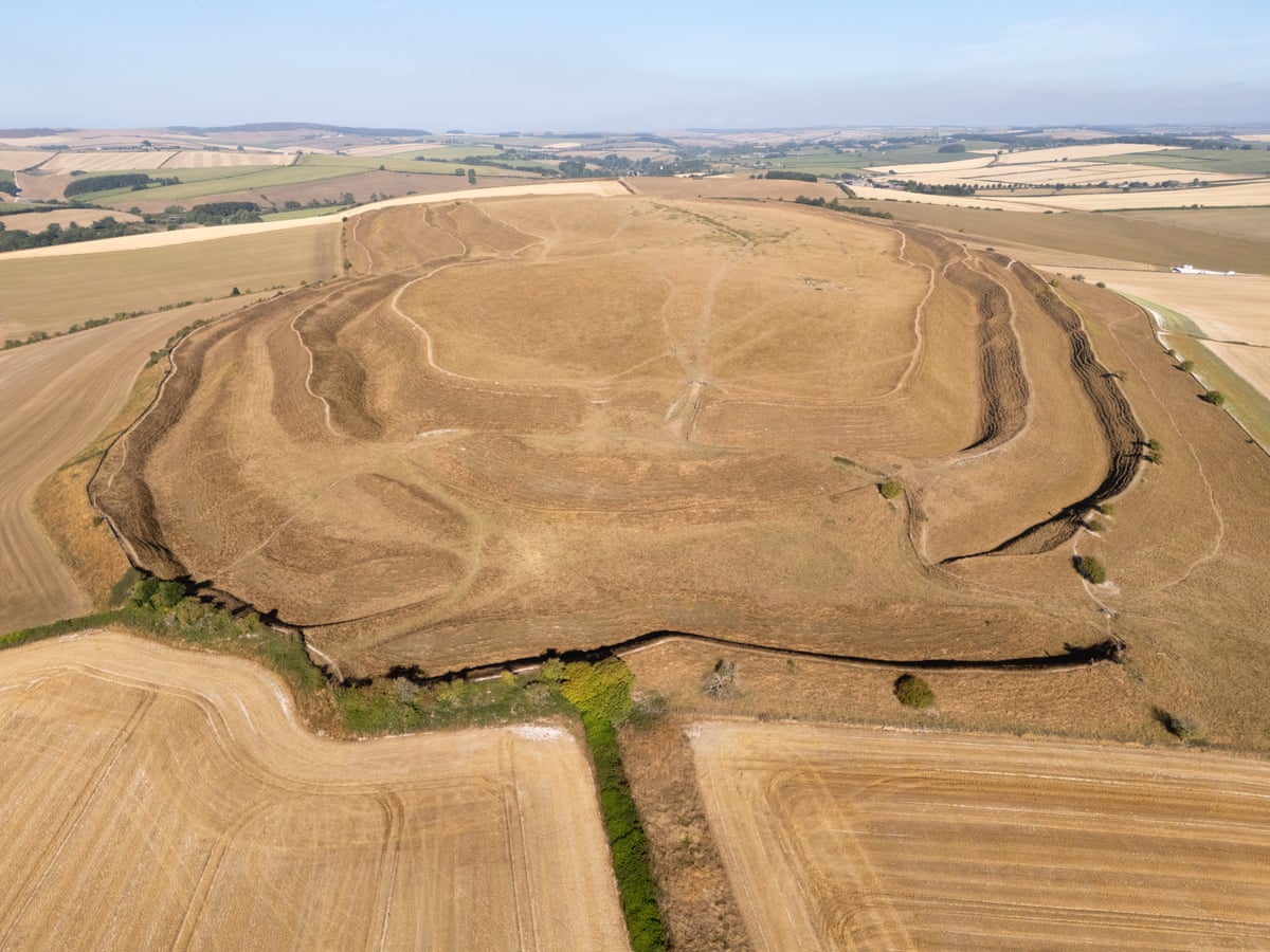 An aerial view of the dried out ground of Maiden Castle Iron Age hillfort in Dorchester, England, on 10 August 2026.