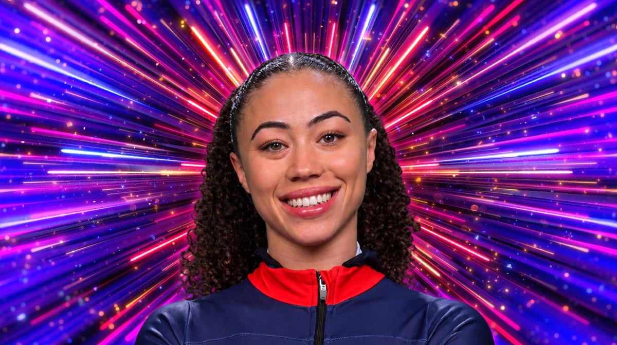 A woman with her hair in a band and a blue and red top