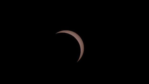 Most of the sun blocked by the moon