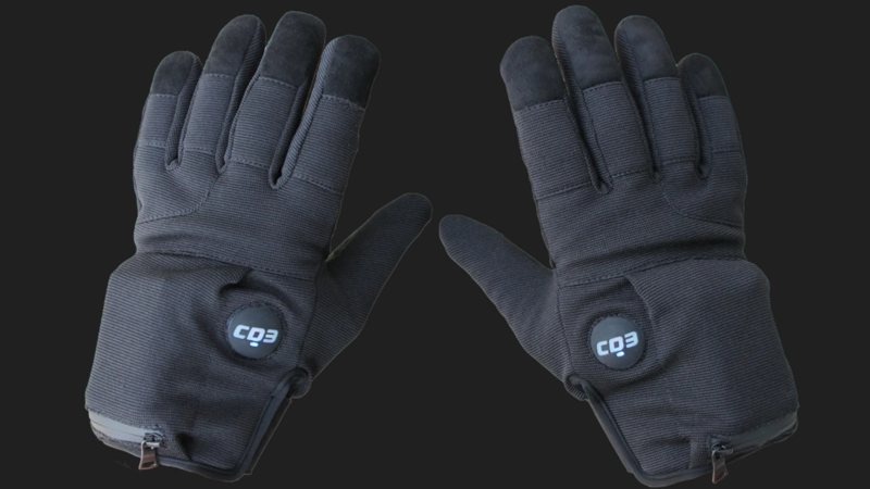 A pair of grey gloves with a button near the thumb that reads