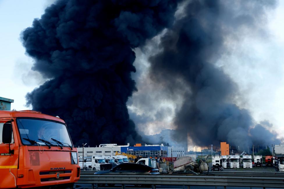 A large black plume of smoke rises out of Wildberries warehouses in Utkina Zavod in St. Petersburg, Russia in June 2026. 