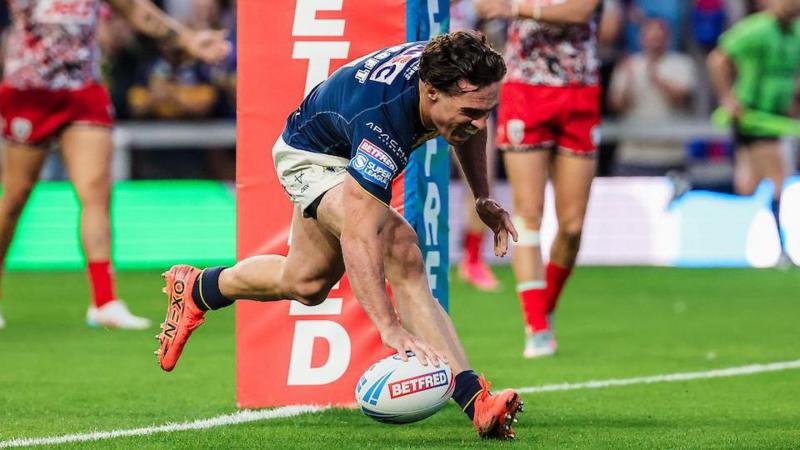 Brodie Croft dotting down the ball in his right hand to score for Leeds Rhinos
