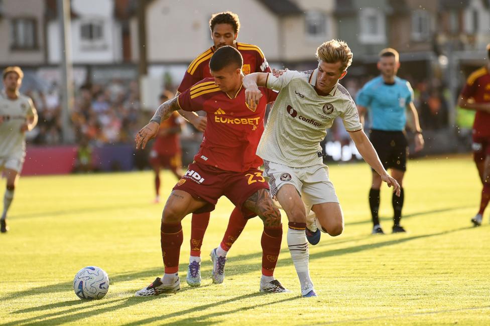 Newport County's Tom Davies challenging for the ball during their friendly against AS Roma.