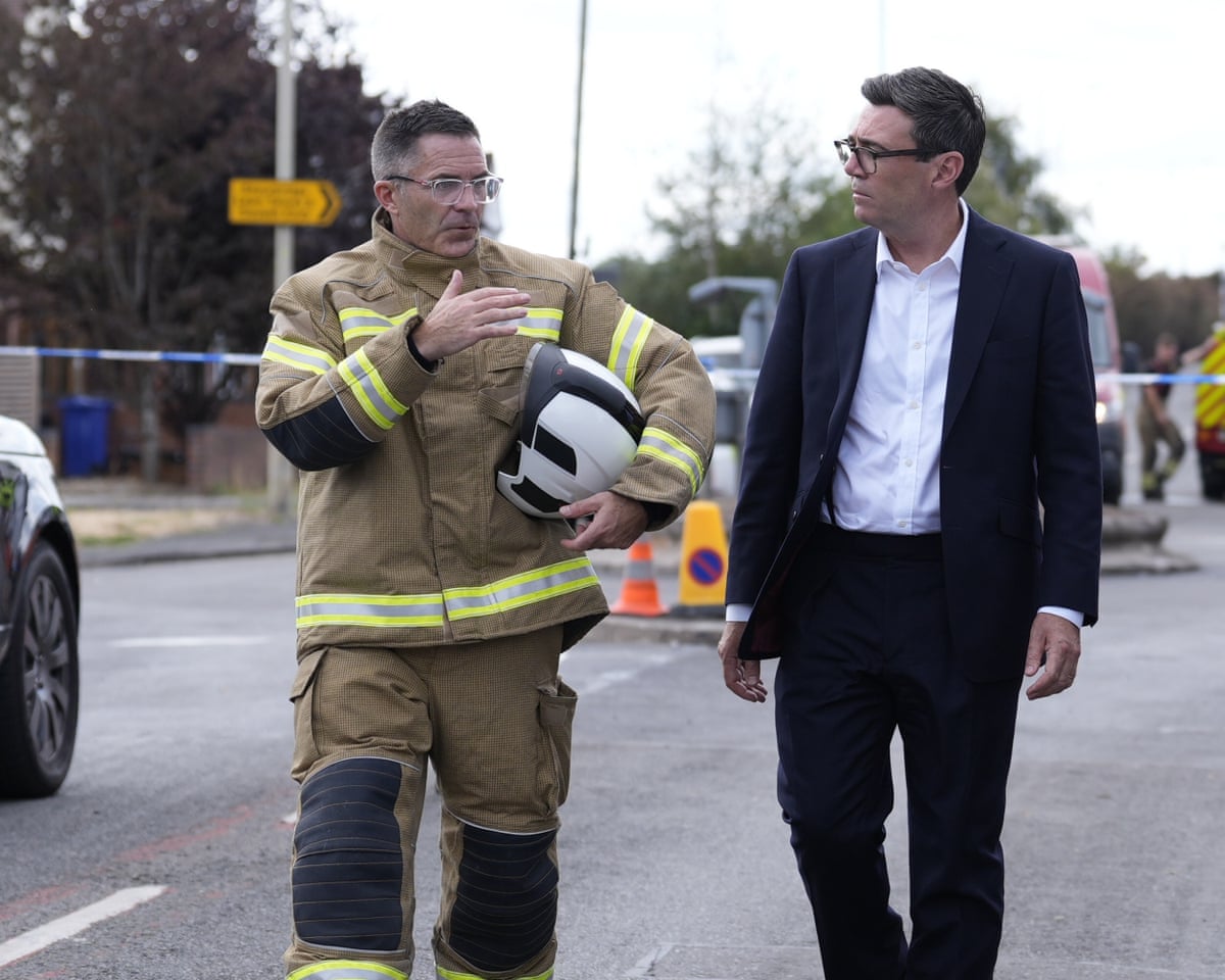Andy Burnham with West Midlands’ chief fire officer, Simon Tuhill, during a visit to Stourbridge, England.