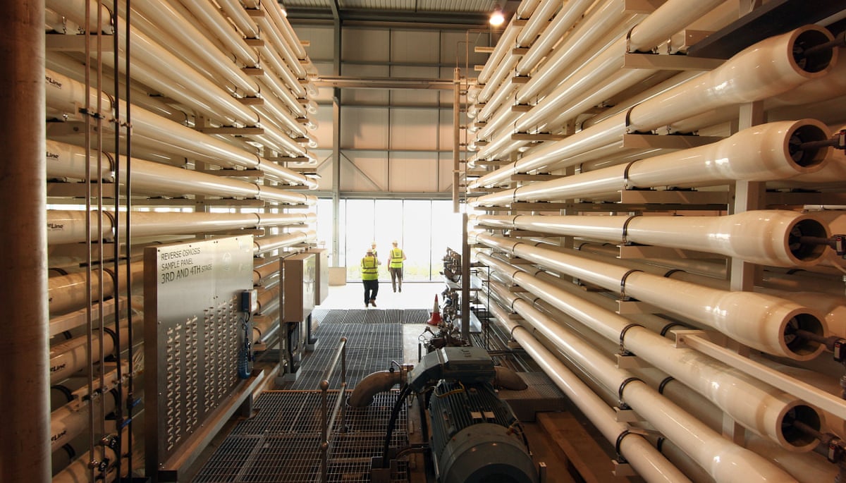 Workers stand near pressure vessels at Thames Water’s desalination plant.