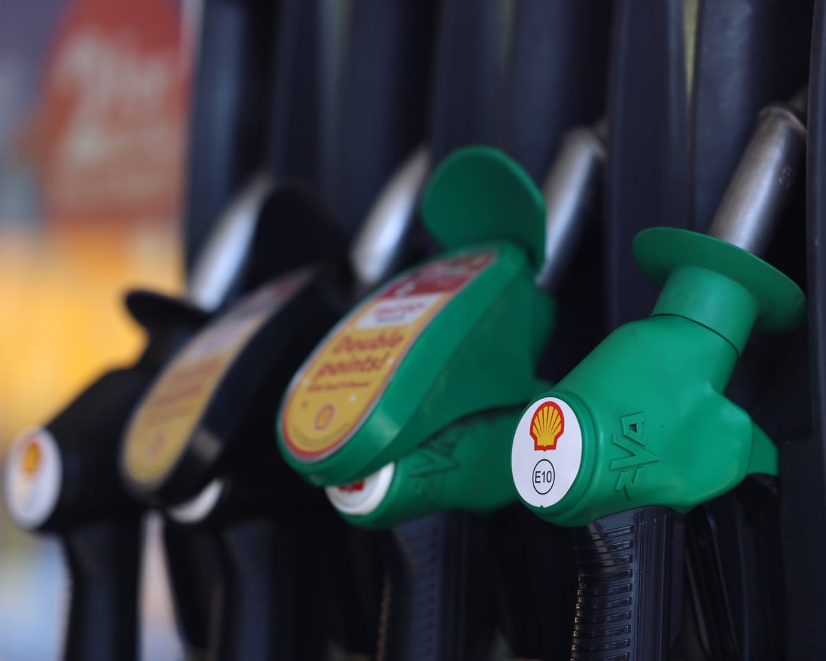 three fuel pumps at petrol station forecourt
