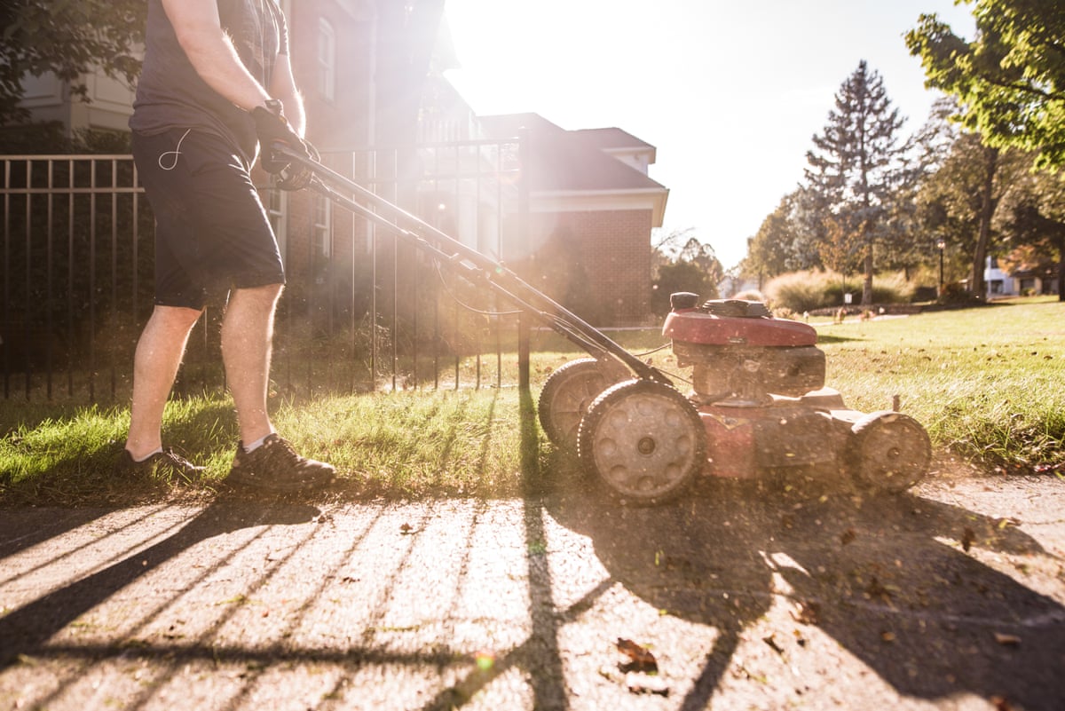 A man mowing a lawn