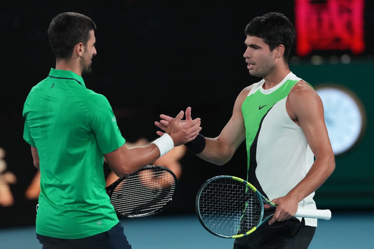 Novak Djokovic shakes hands with a victorious Carlos Alcaraz after the Spaniard beat him in the Australian Open final in February