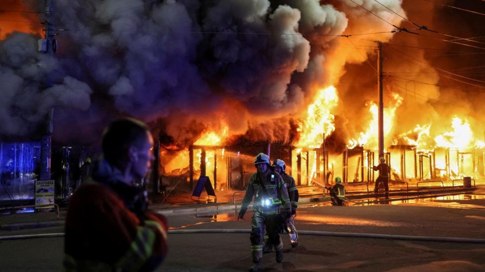 Firefighters work at a site of a book market hit by a Russian missile strike, amid Russia's attack on Ukraine, in Kyiv, Ukraine August 16, 2026.