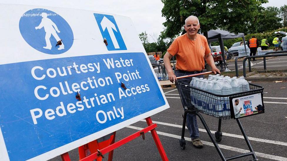 South East Water customers collect water from a collection point