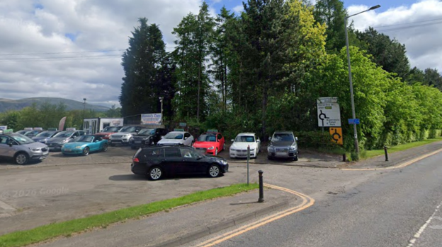 A car dealership by a road
