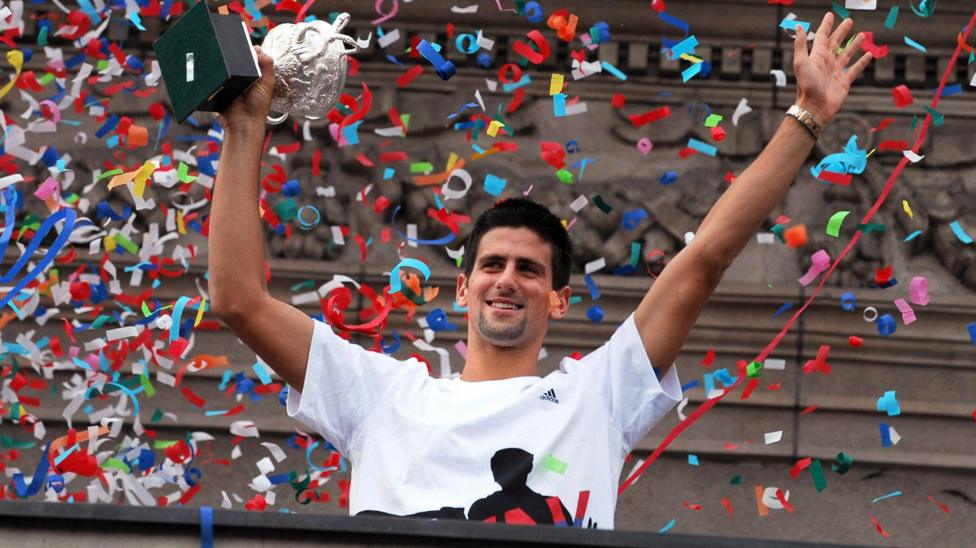 Novak Djokovic waves to a crowd in Belgrade in 2008