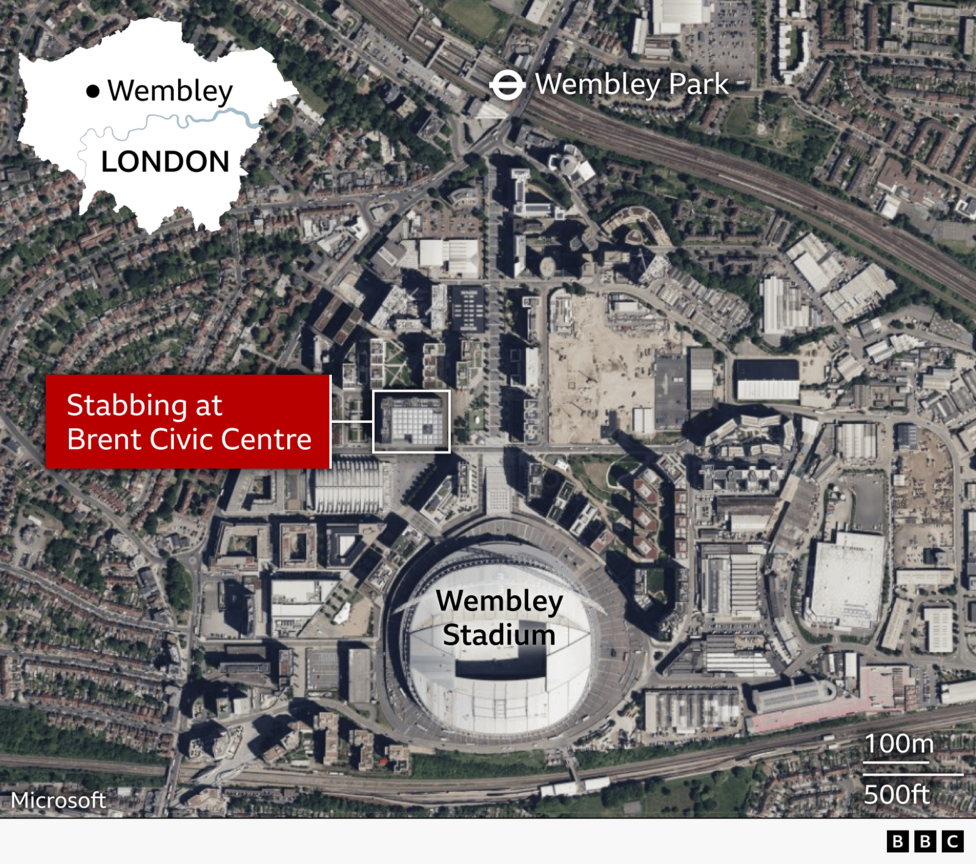 Satellite map of Wembley in northwest London showing the area around Wembley Stadium and Brent Civic Centre. Wembley Stadium is labelled near the bottom centre, and Wembley Park Underground station is marked to the north. A red callout box labelled “Stabbing at Brent Civic Centre” points to a highlighted building just northwest of the stadium. An inset map of London in the top left shows Wembley’s location within the city. Distance scales of 100 metres and 500 feet appear in the bottom right.