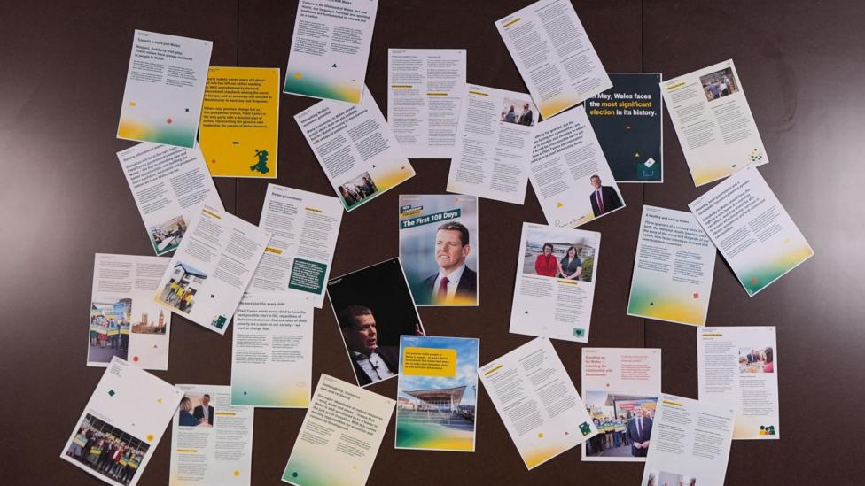 A set of documents attached to a Wall, with Plaid Cymru branding