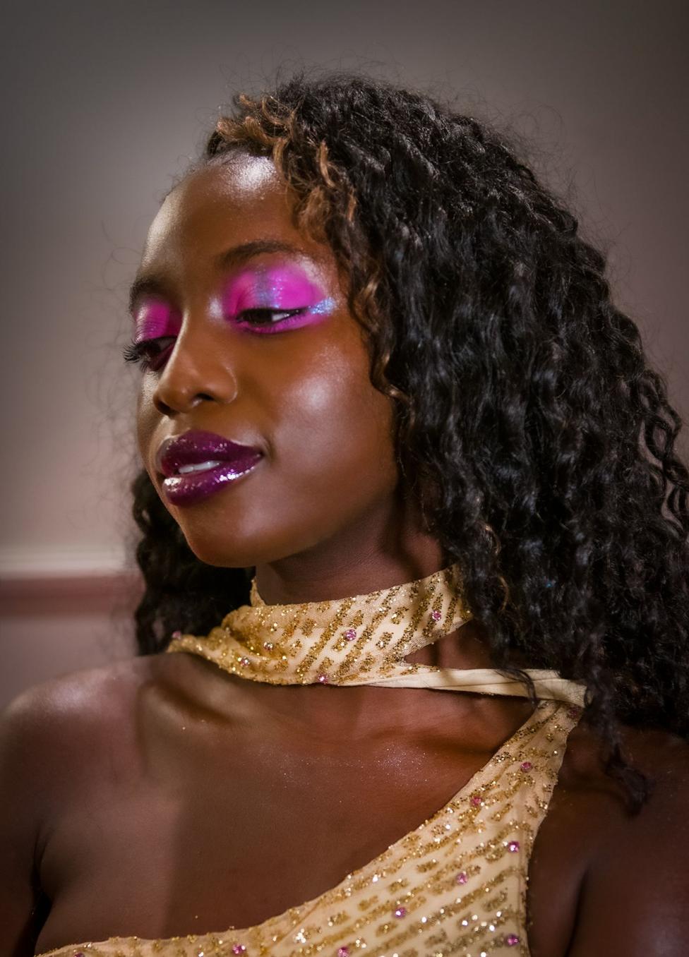 Jonelle Awomoyi with completed neon glitter festival make-up