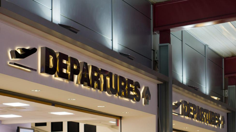 Departures sign at Luton Airport