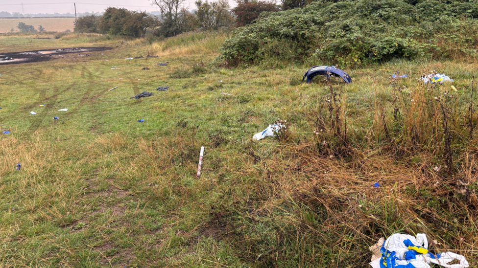 Debris, including a car registration plate, scattered across a field in County Durham following a vigil on Thursday.