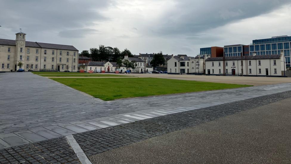 A series of buildings line the perimeter of a civic square at Ebrington in Derry