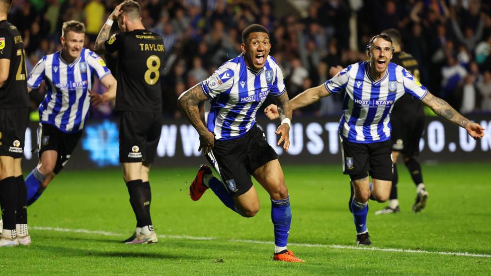 Liam Palmer celebrates scoring for Sheffield Wednesday against Peterborough in May 2023