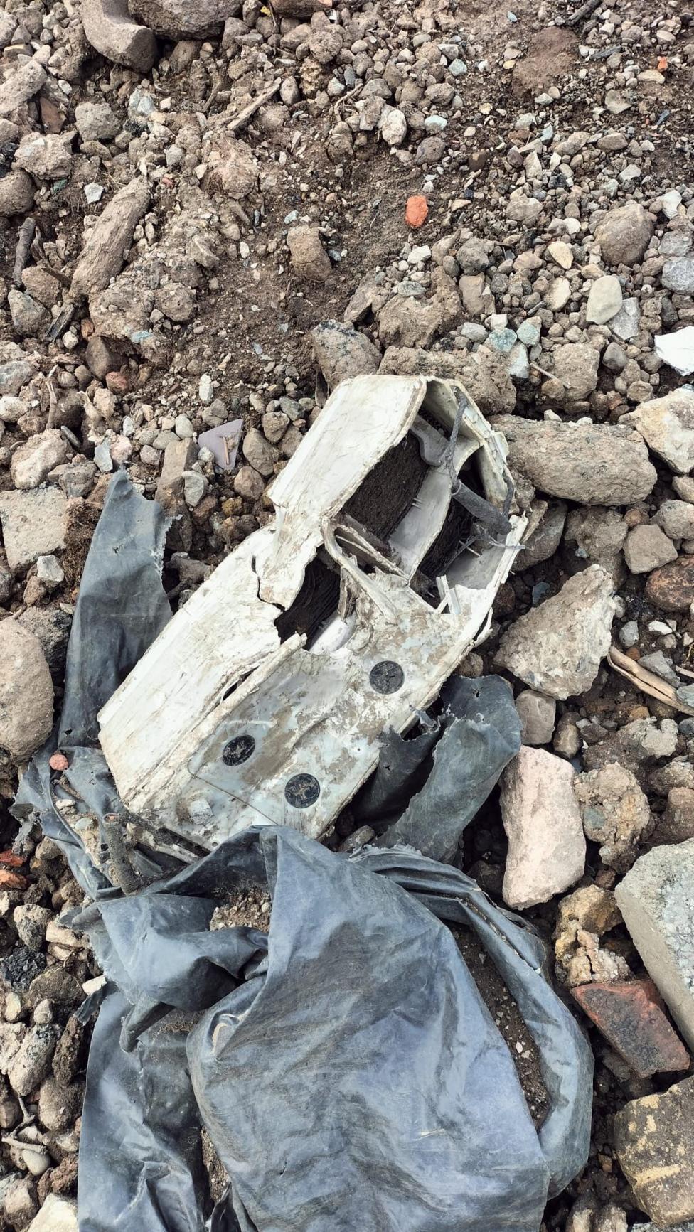 An image shows the material being left behind at the site