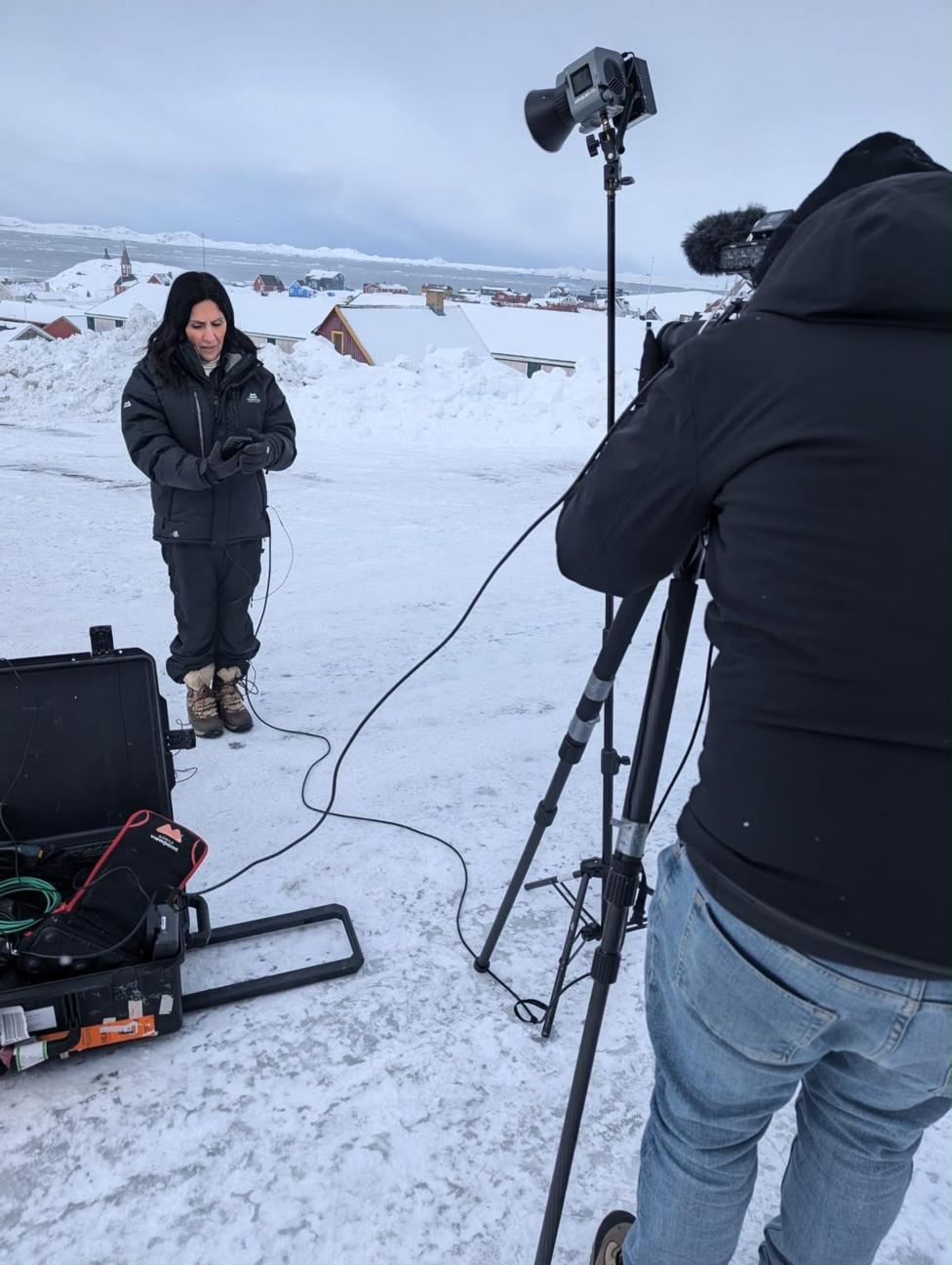 Maryam Moshiri in front of a camera