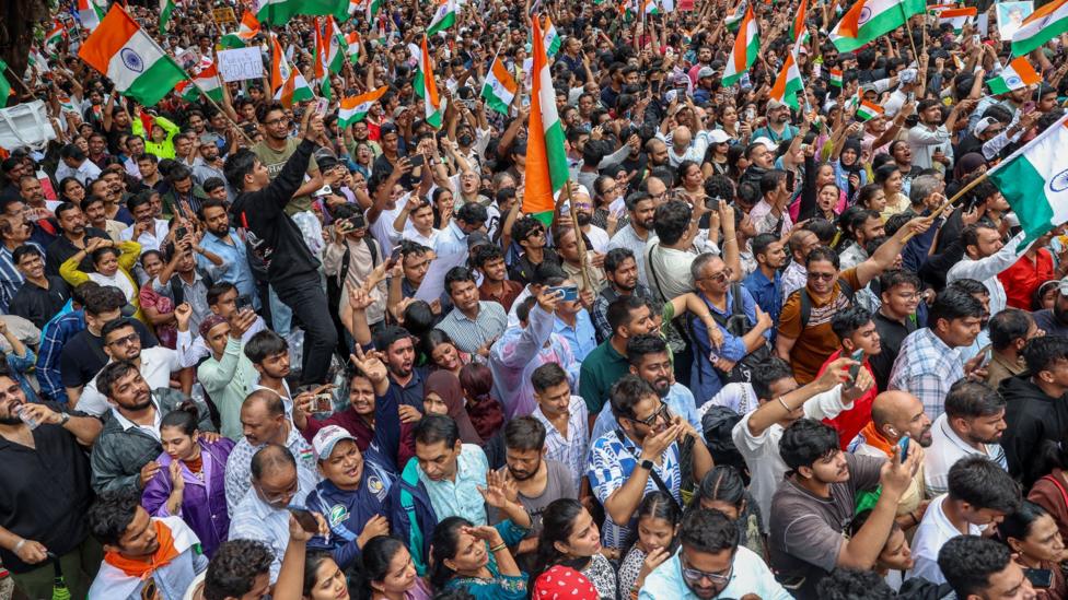 Supporters of the youth-led satirical political movement Cockroach Janta Party (CJP) celebrate the resignation of Union Education Minister Dharmendra Pradhan, in Mumbai, India, 26 July 2026.