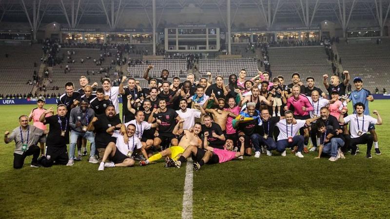 Sabah pose for a group photo on the pitch after qualifying for the Champions League