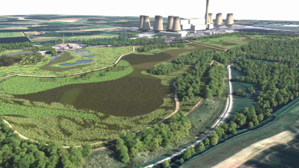 An aerial image showing the site of a power station including cooling towers and surrounding green land.