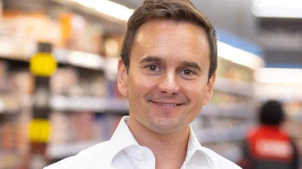 Lord Richard Walker wears a white shirt