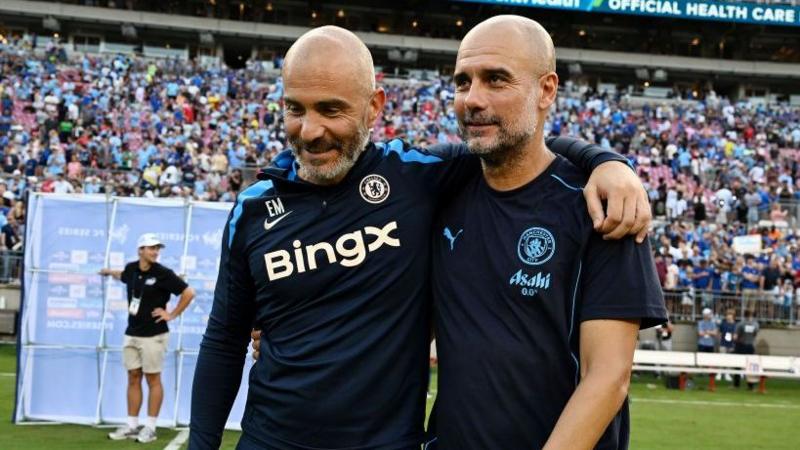 A smiling Enzo Maresca and Pep Guardiola chat after a pre-season friendly between Chelsea and Manchester City in the USA in 2024
