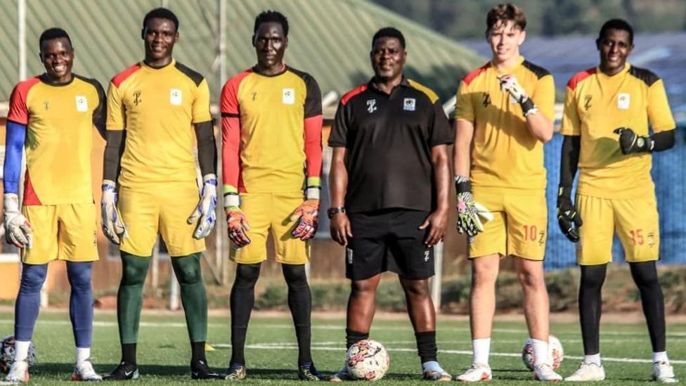 Uganda players with Olly Fisher