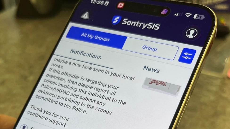 A mobile phone screen showing an app with SentrySIS as the heading and then notifications and news