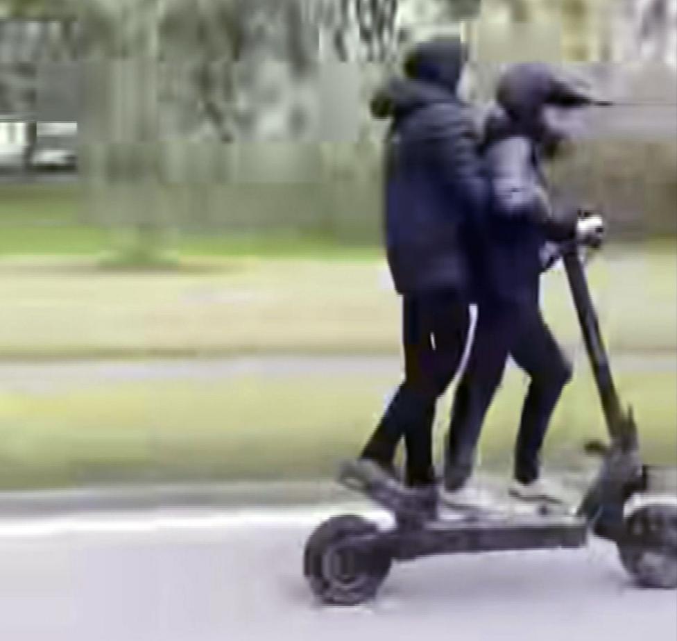 Two children on an e-scooter