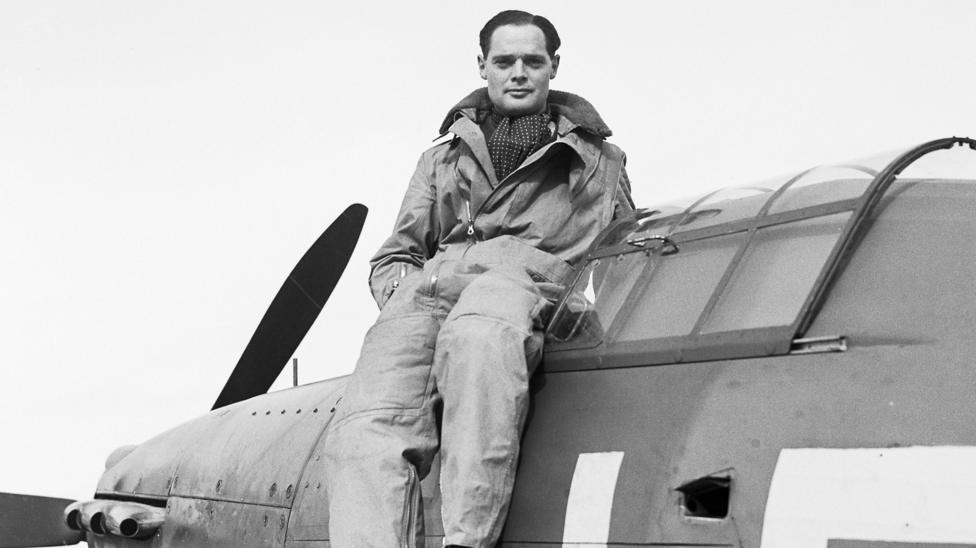 Squadron Leader Douglas Bader DSO DFC CO of 242 Squadron, Royal Air Force seated on the cockpit of his Hawker Hurricane, October 1940.