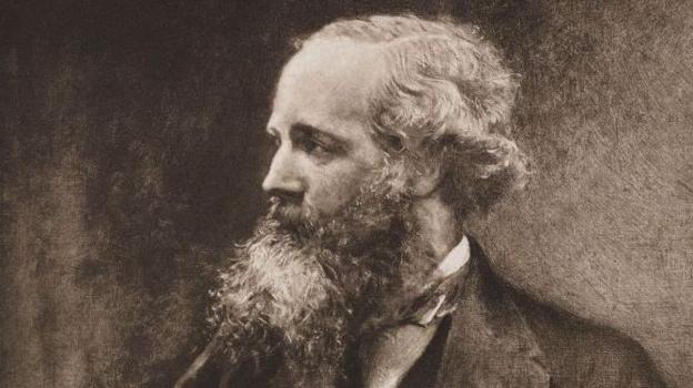 A black and white image of James Clerk Maxwell with wavy grey hair and a long beard.