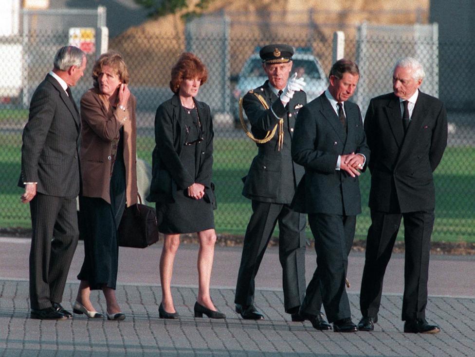 King Charles III (then Prince Charles, the Prince of Wales), Lady Jane Fellows (left) and Lady Sarah McCorquodale with officials at RAF Northolt to meet the coffin of Diana Princess of Wales, as it arrives from Paris where she was killed in a car crash, 31st August 1997. 
