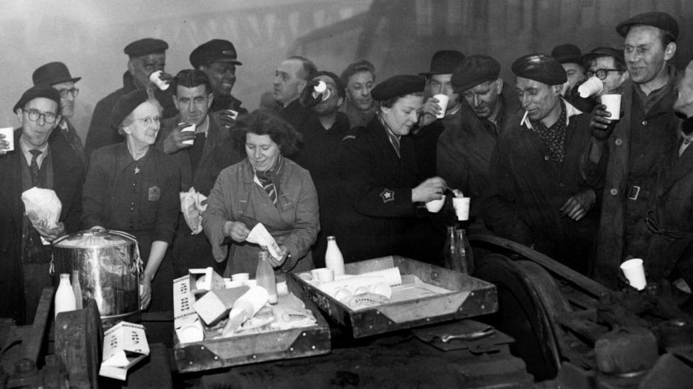 Volunteers helping rescuers at the scene of the train crash near St John's in 1957