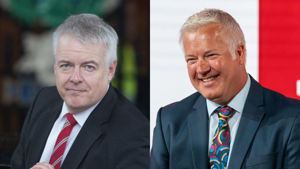 A side by side picture of Carys Jones (left), and Derek (right). Both men have short white hair and wear dark suits with white shirts.