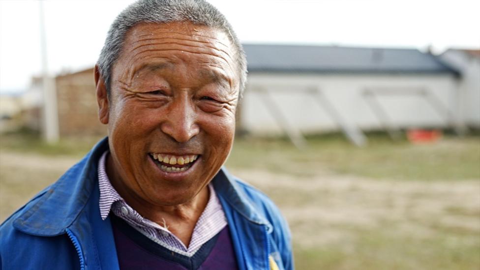 A smiling farmer