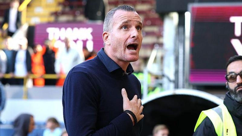 Nicky Hayen shouts to fans and holds his chest