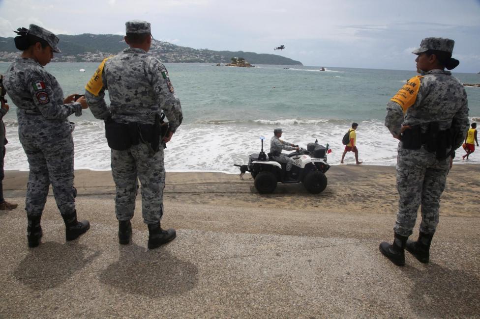 Members of the National Guard, one of them driving an ATV, patrol a beach as part of the Army, Air Force and National Guard's DN-III disaster relief plan as Category 5 Hurricane Polo strengthens off Mexico's Pacific coast, bringing heavy rain and flooding risks despite a forecast track away from shore, in Acapulco, Mexico, September 22, 2026.