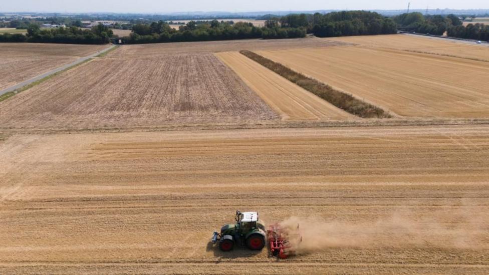 A tractor in a large field