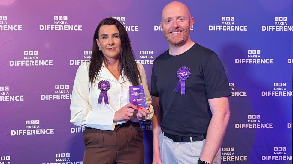 Woman with dark hair and man with ginger beard