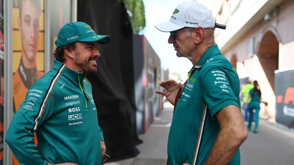 Fernando Alonso in conversation with Aston Martin managing technical partner and team principal Adrian Newey in 2025