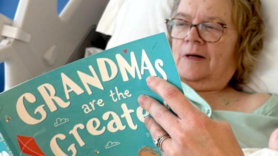 Not long after recovering from the seizures, Ann was fit enough to hold Patrick's baby - her youngest granddaughter - and read her a story from the hospital bed.