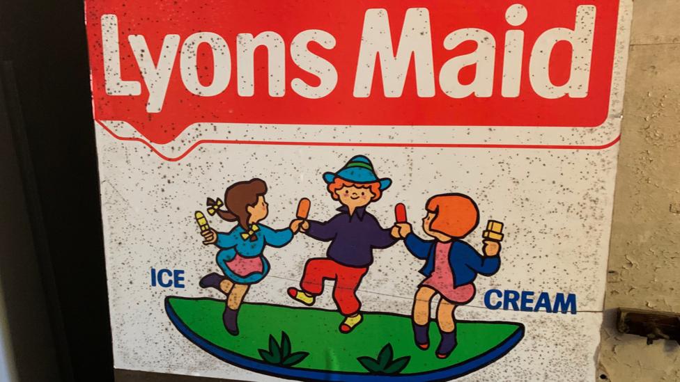 An advert for Lyons Maid ice cream with three children dancing around with ice creams in their hands