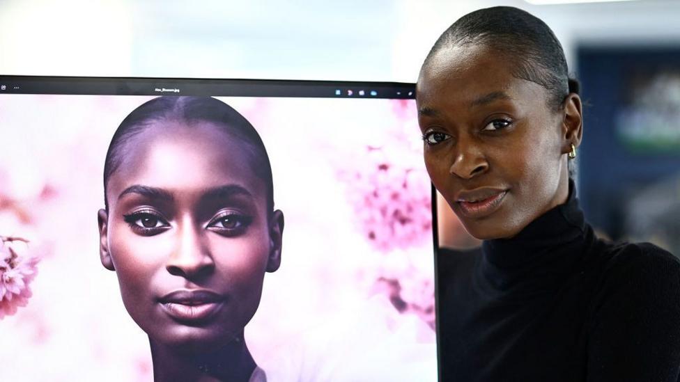 London-based model Alexsandrah Gondora (R) poses for a photograph beside her AI twin "Alex" (L), created by digital modelling agency, The Diigitals in the AFP offices in London on February 21, 2025. My artificial intelligence (AI) replica "basically does the hard work so I don't have to do it," jokes London-based model Alexsandrah Gondora, who enjoys being able to "be in two places at once."