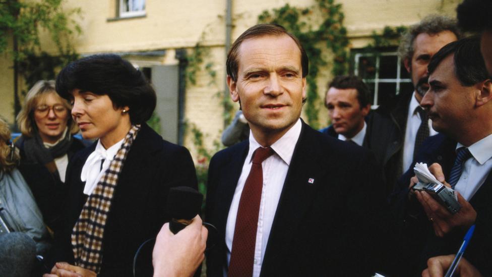 Mary and Jeffrey Archer surrounded by members of the press after the Daily Star alleged that he had slept with a sex worker