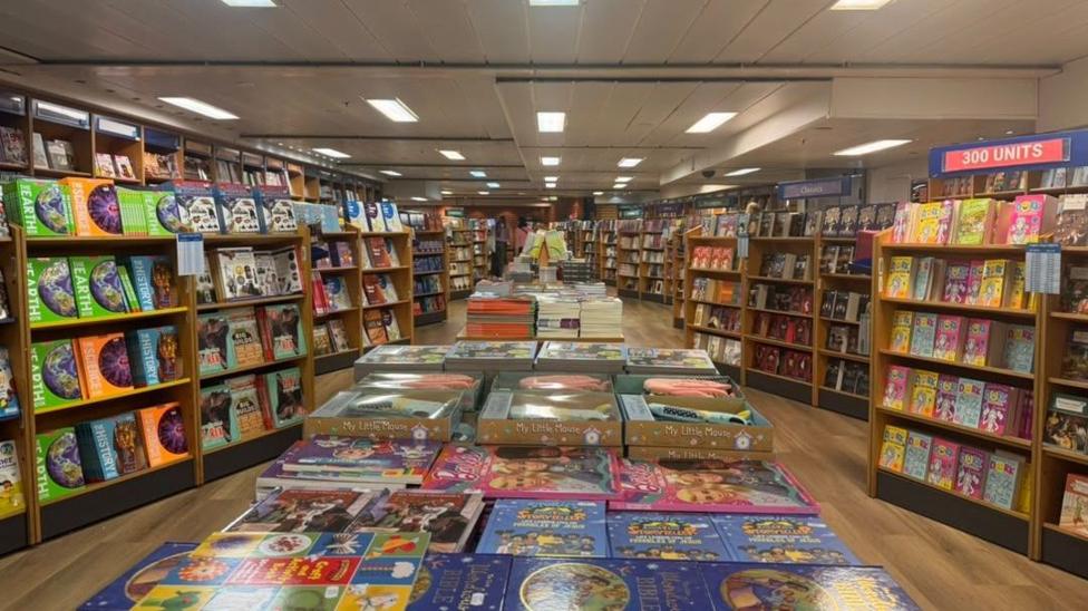 A room full of books of varying colours